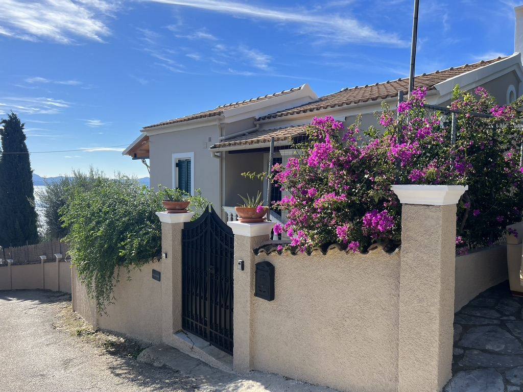 The gate and bougainvillea at the villa entrance